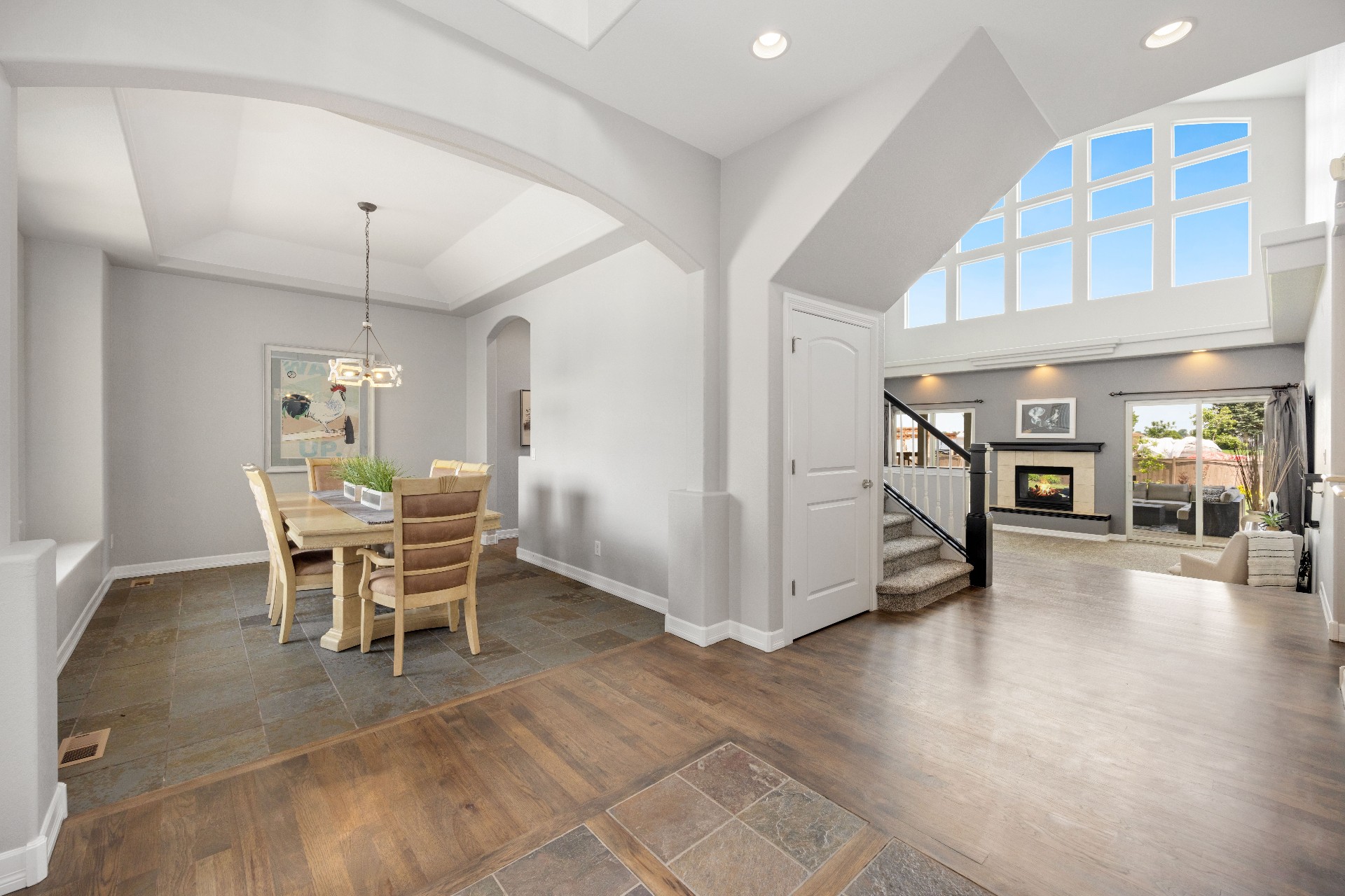 Interior 90732 — bright open living and dining area with vaulted ceiling