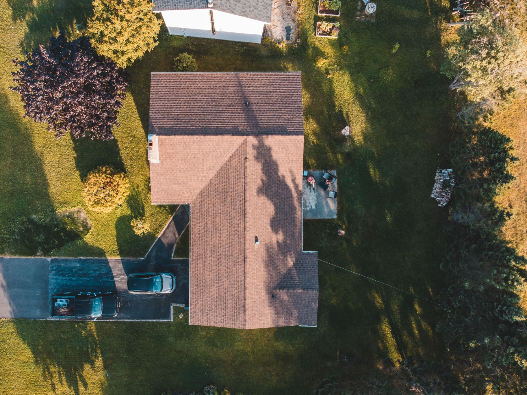 Top-down aerial of suburban home with driveway