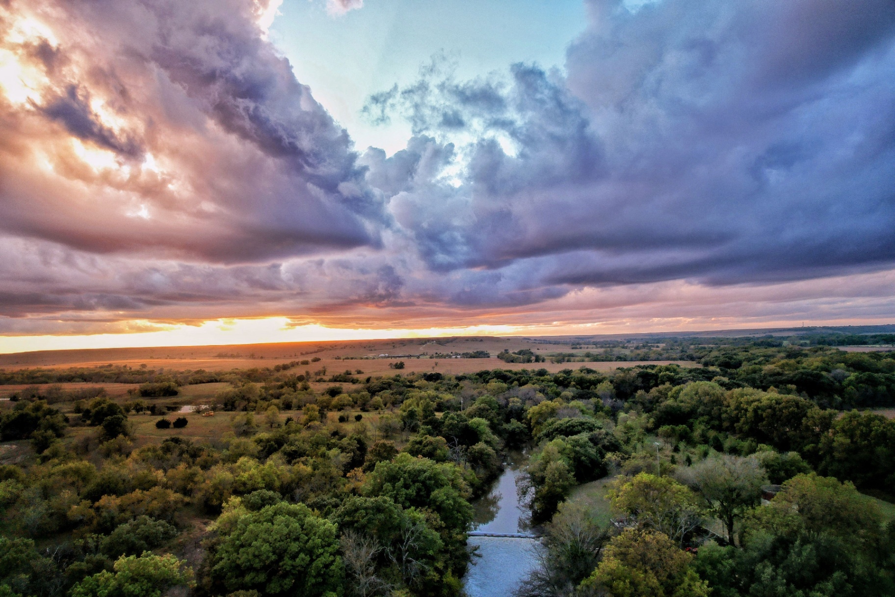 Sunset over creek and countryside