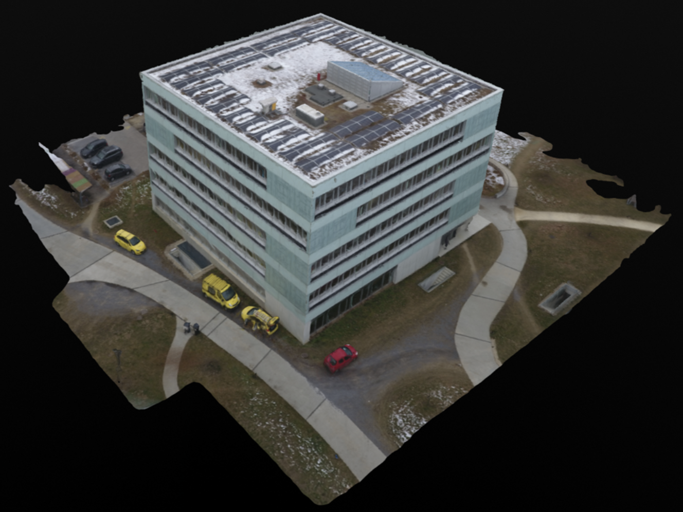 Textured 3D photogrammetry model of an office building and its surrounding parking lots, walkways and grounds