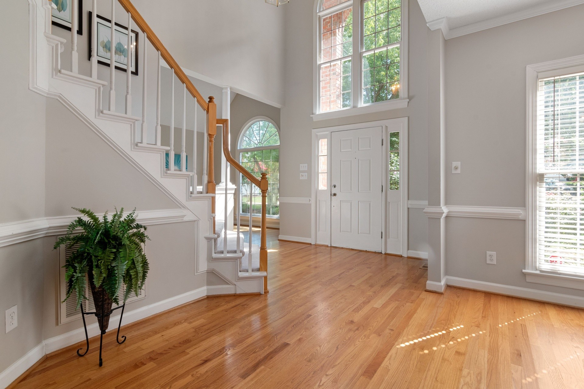 Interior 45286 — grand foyer with staircase and tall front windows