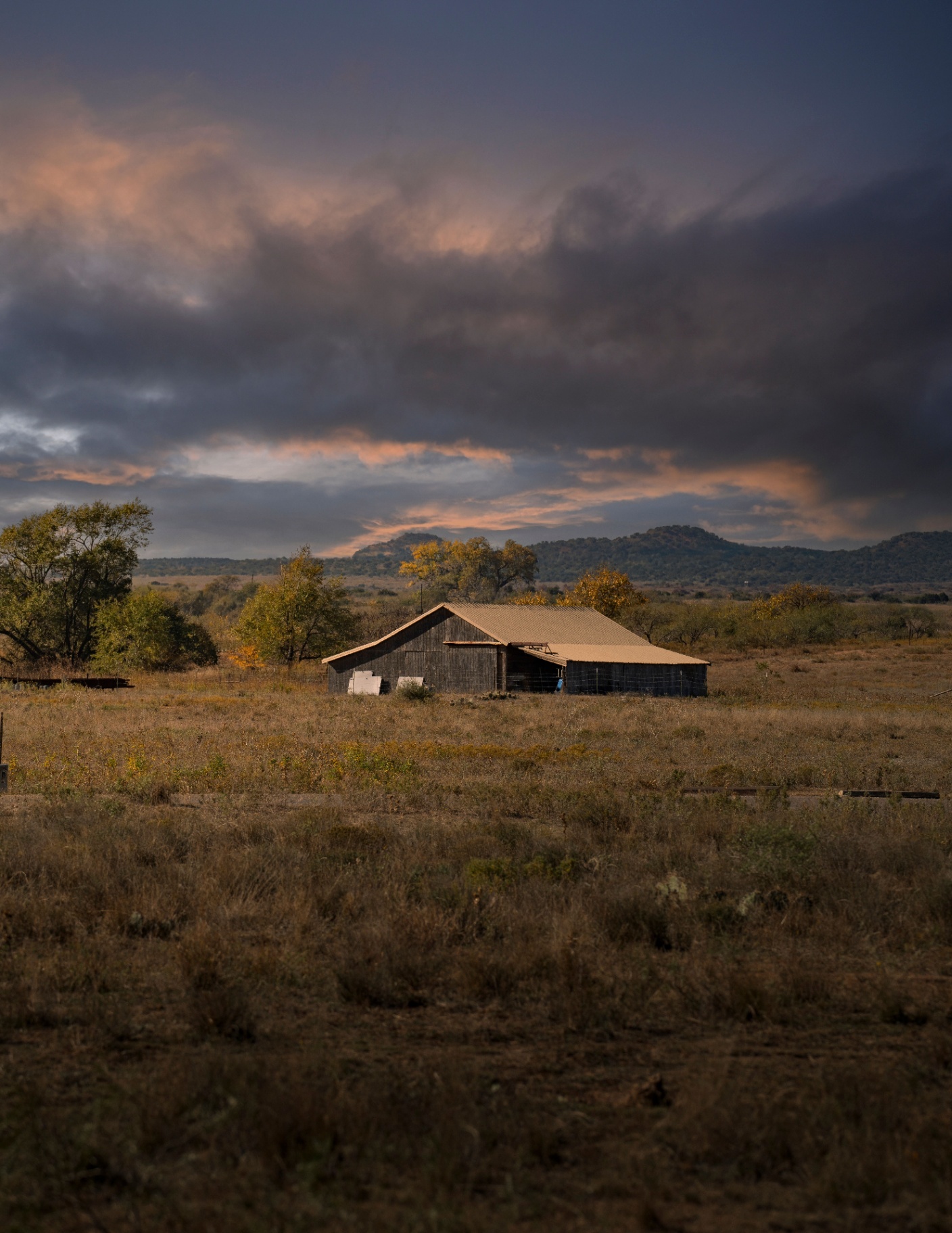 Historic barn with hill country sunset