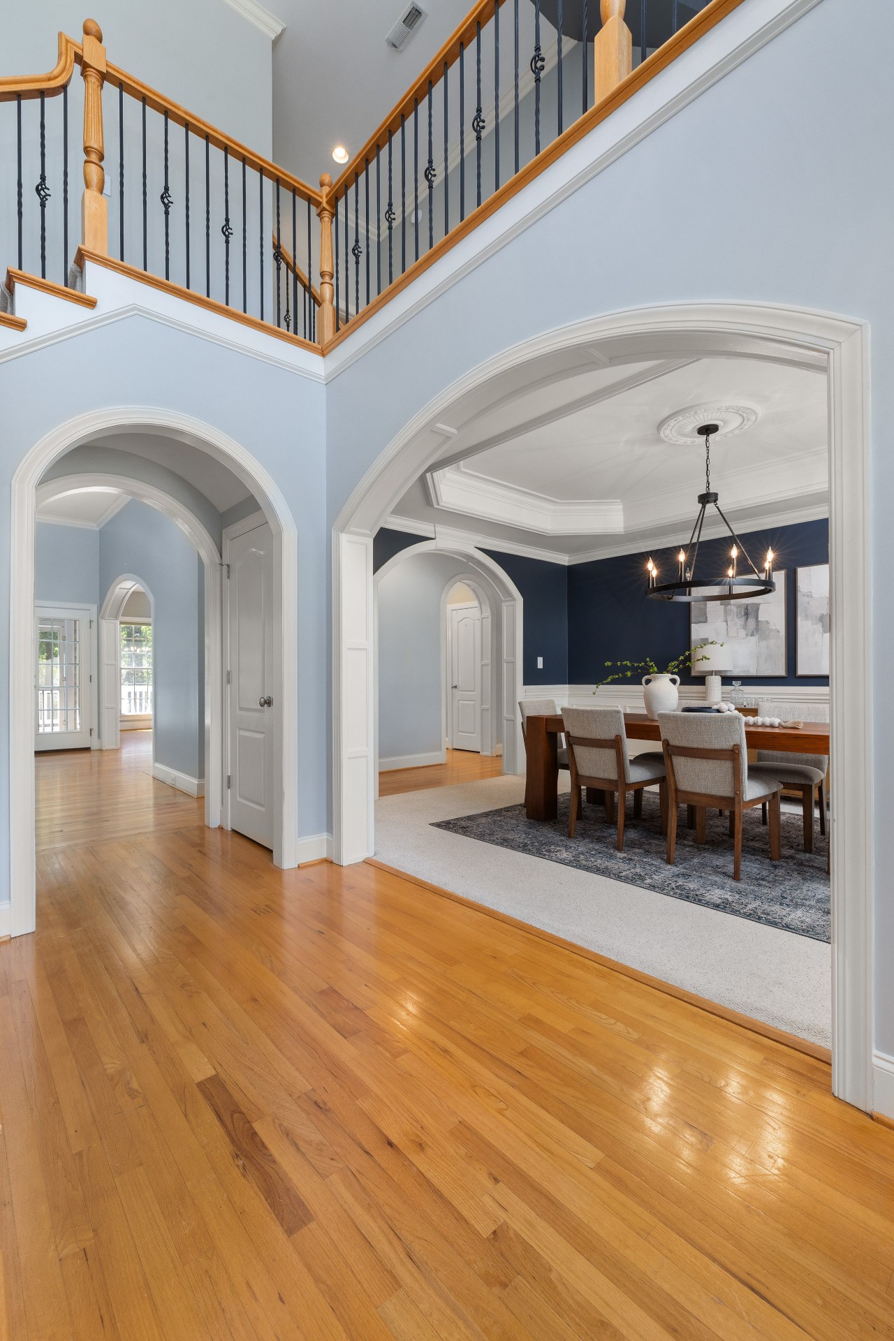 Interior 29543 — airy two-story foyer with archways and formal dining room