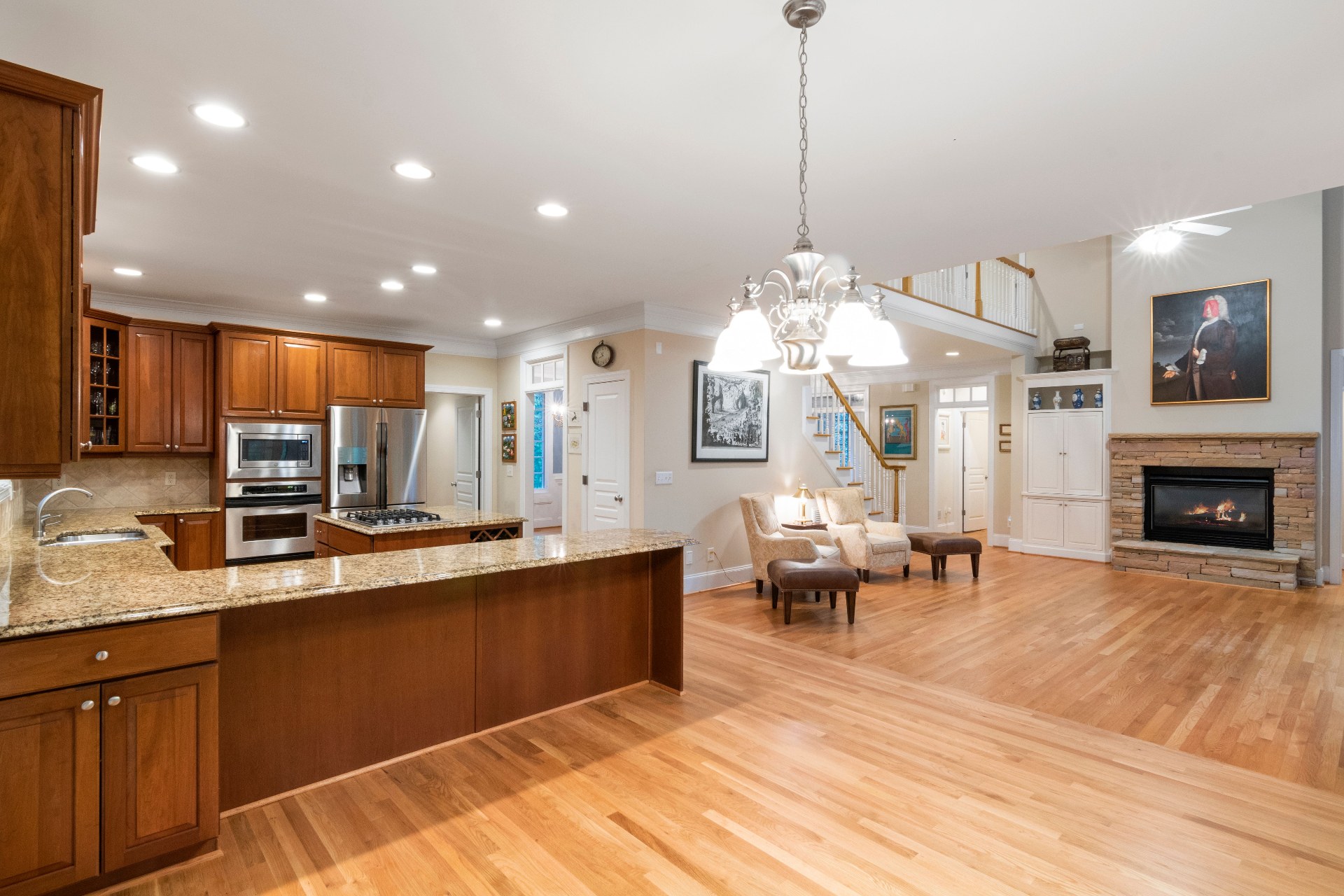 Interior 19384 — great room with hardwood floors and fireplace