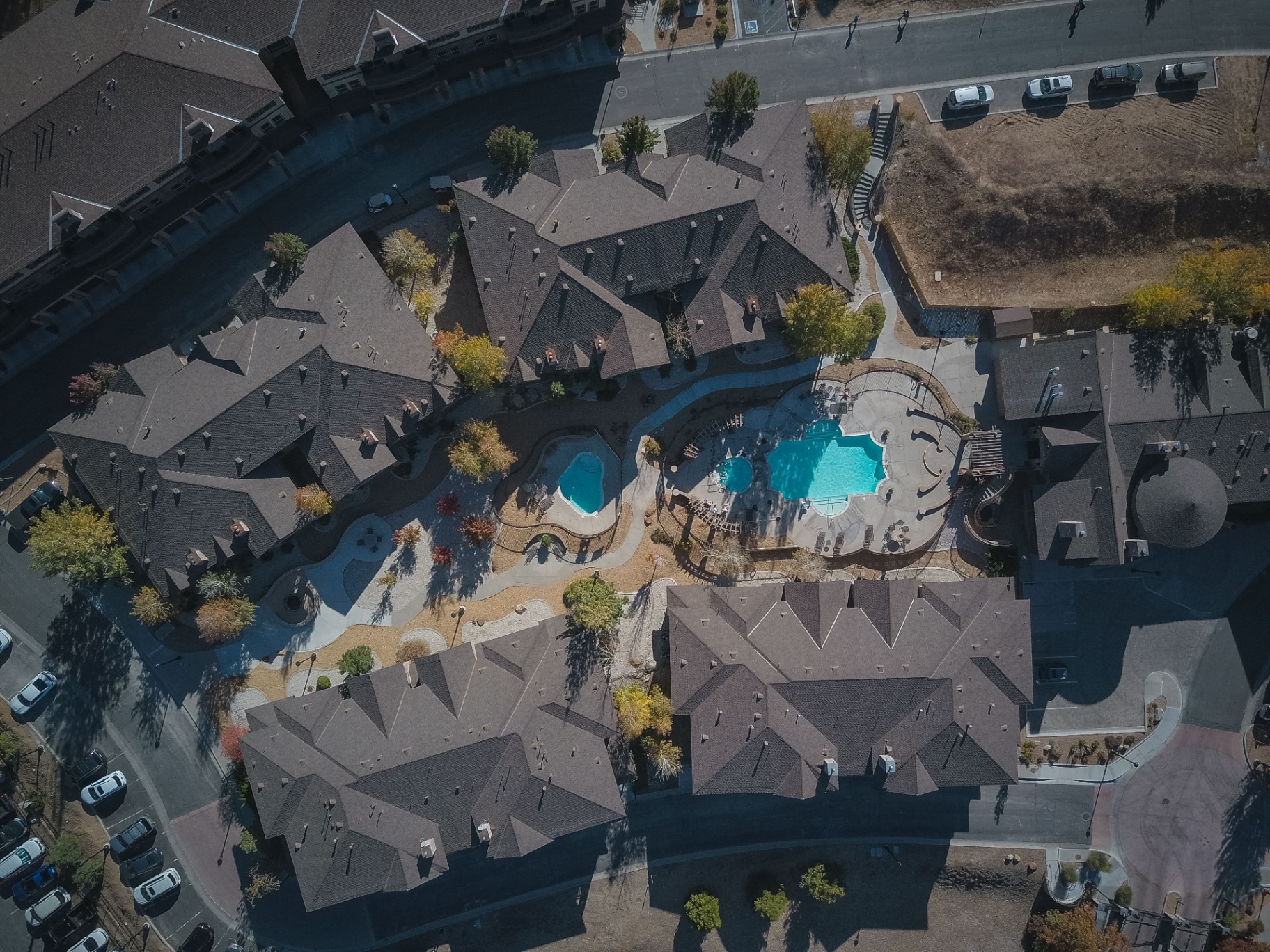 Aerial of multi-family complex with resort pool