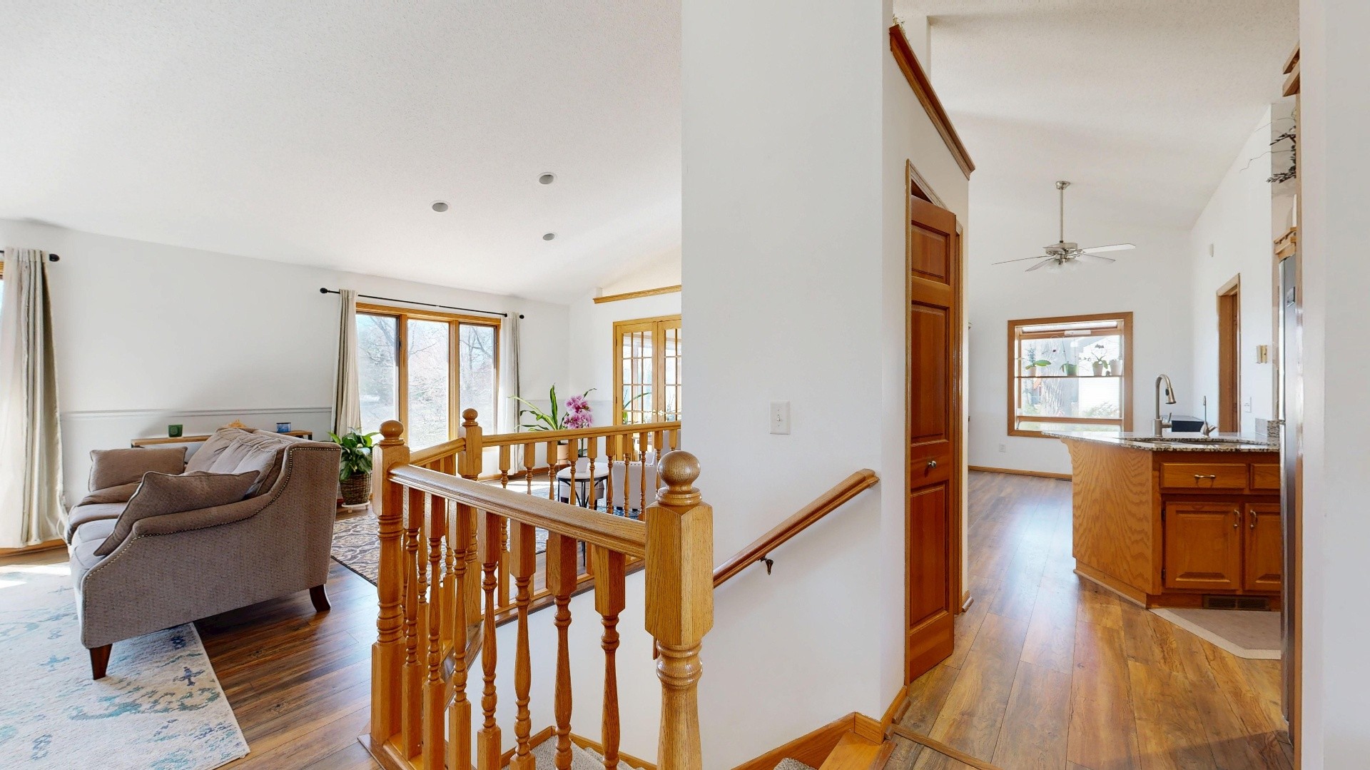 Interior 59306 — split-level entry with oak railing and open living