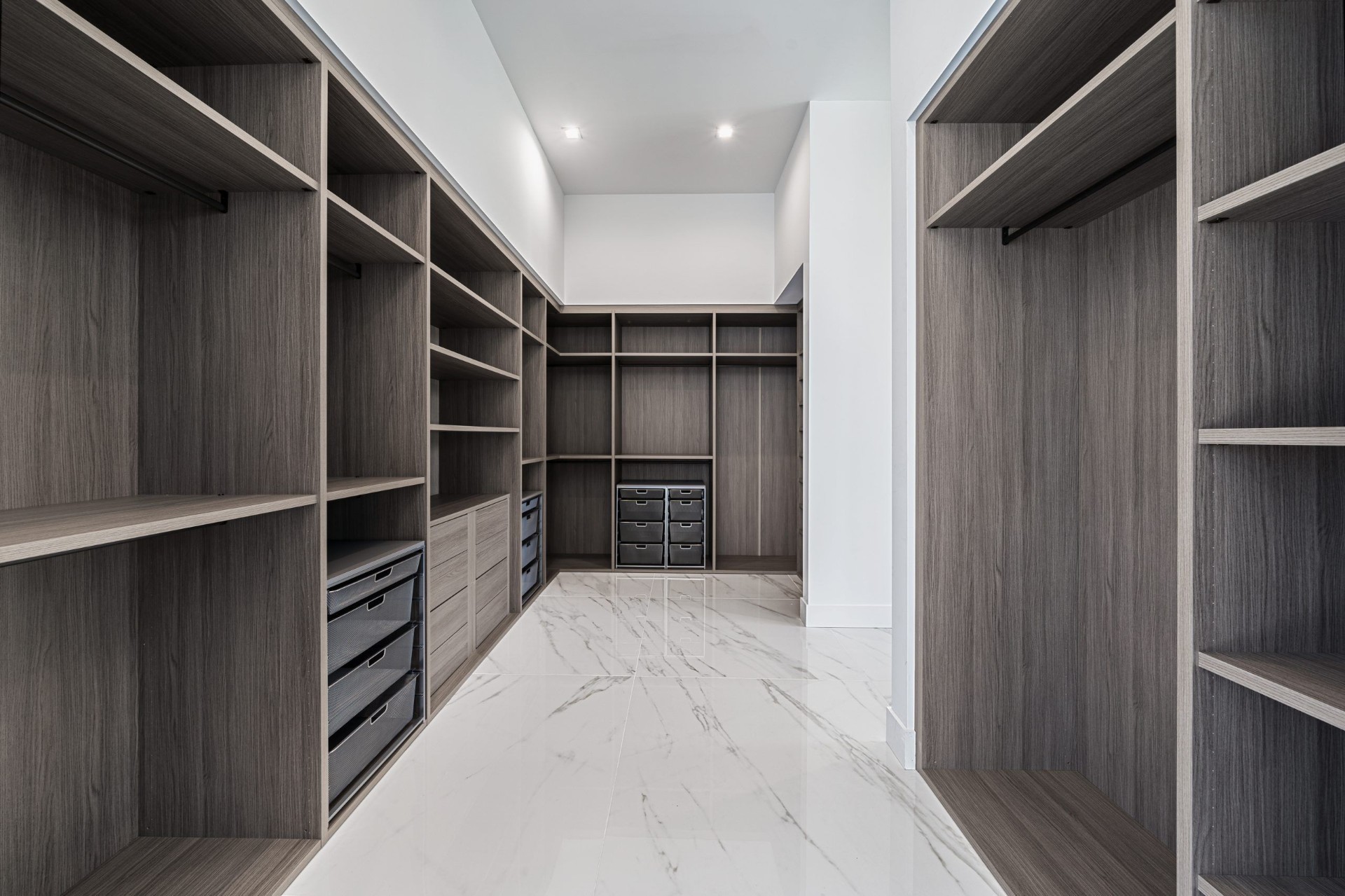 Interior 38076 — spacious walk-in closet with marble floors and custom shelving