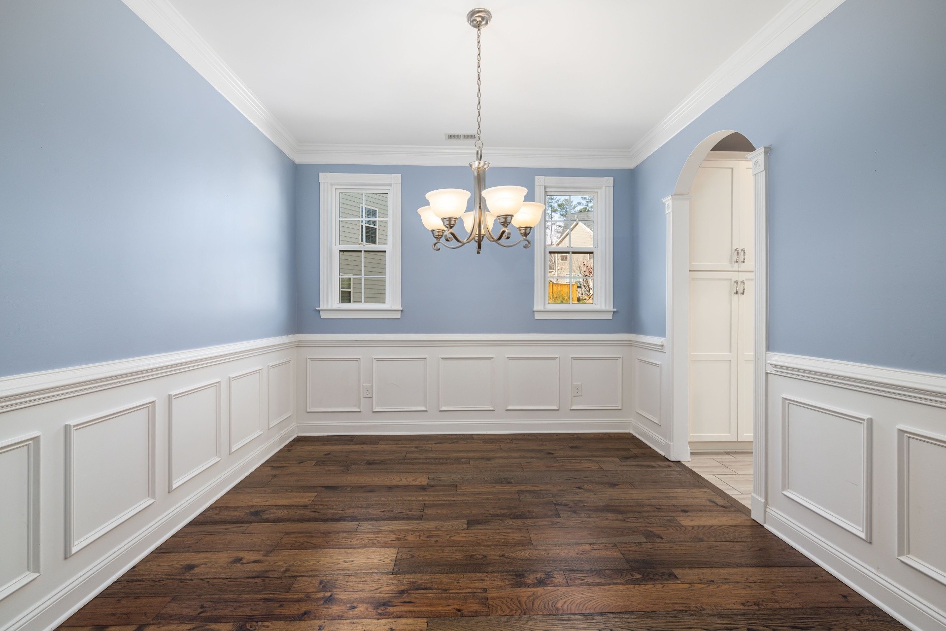 Interior 72508 — formal dining room with wainscoting and chandelier
